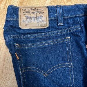 Vintage 517 made in USA Levi's straight jeans in dark blue.